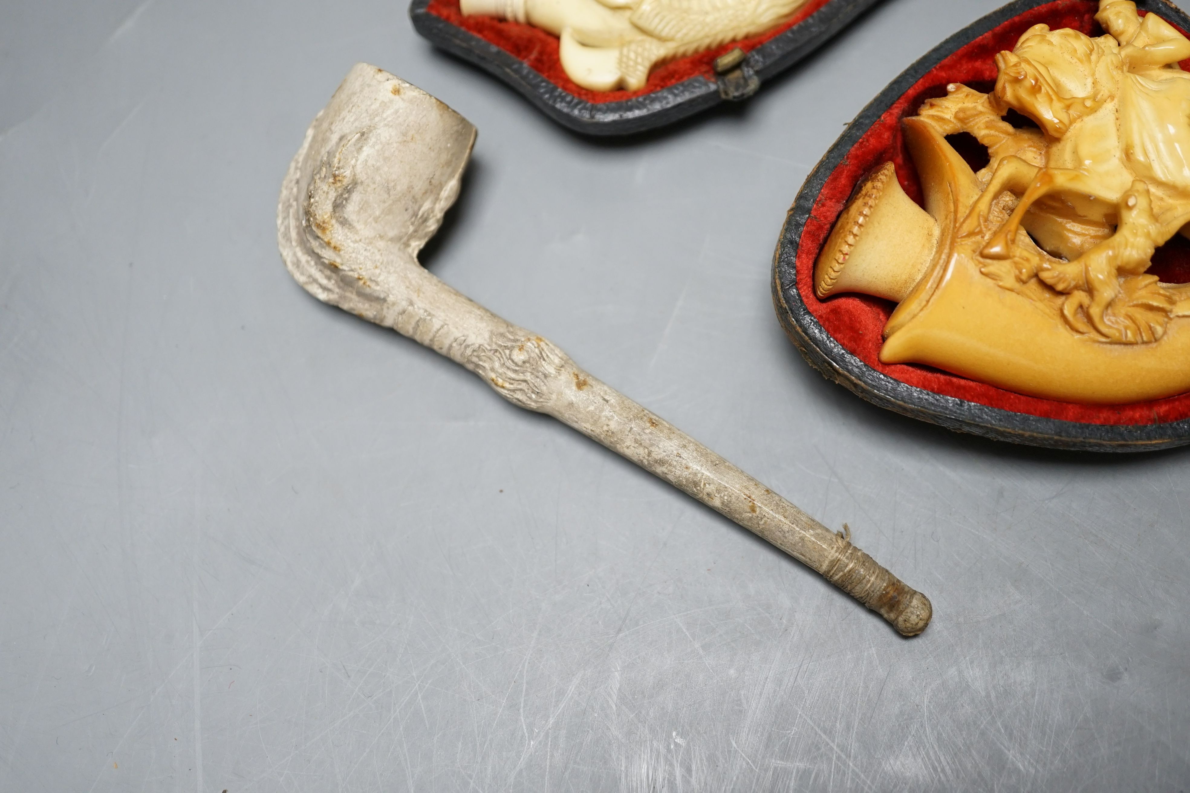 Three cased meerschaum pipes, another pipe and two bone cheroot holders